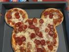 Mickey mouse pizza at Disneyland was so yummy and cheesy! 