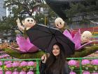 The colorful lantern display and the little monk statues behind them