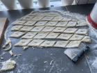 The dough after being cut with a rolling kleinur cutter