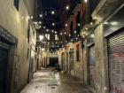 A typical narrow street in my neighborhood (El Born) at night with an added touch of lights