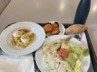 A lunch from my cafeteria with a small egg dish, fish with sides and a dessert of roasted yam