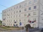 This is Josué's apartment building. It is common for people to hang their clothes out the window to dry!