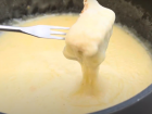 Fondue is a dish of bread and cheese. The cheese is cooked with wine and pepper and is unique to Switzerland, which makes it even tastier.