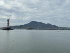 In northwestern Taipei, the Tamsui River meets the Taiwan Strait in a huge estuary. Across the water, you can watch the storms roll over the hills