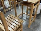 This is a typical Taiwanese school desk. They are all wood and can be kind of heavy! Students store their textbooks and supplies in the cubbies under the desk and chair