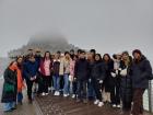 A group photo of me with Erasmus students in front of Le Mont-Saint-Michel