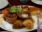 Appetizer board with kaymak, bread, potatoes and lettuce