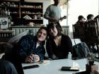 Here is a photo of my friend Isa and I playing cards at a cafe.