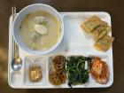 A Korean cafeteria lunch with traditional Seollal (Korean Lunar New Year) dishes