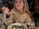 My sister eating finnbiff, which is reindeer stew!