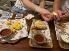Eating cassava, spring rolls and fried corn at Senja restaurant