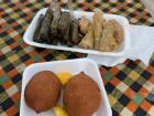 In this image, you'll find İçli köfte (fried dough with beef inside) and sarma (cabbage leaves stuffed with meat).