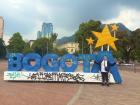 Mom in front of the Bogotá sign