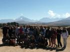 The entire volunteer group in Peru, with the Andes mountains in the background 