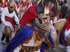 The traditional mask is often decorated with scenes of space or celestial imagery