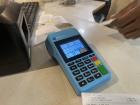 Point of Sale (POS) machine on the counter after buying a refreshing smoothie from Coffee Bar.