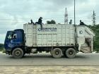 Garbage disposal men ride on top of the truck due to a lack of space and for a faster commute. Don't try this at home!