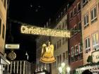 Each street leading to the Christmas Market displays this sign to welcome visitors to the famous Christkindlesmarkt; do you see the iconic Christkind below the sign?