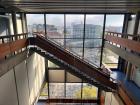 Inside my architecture school building, with a view of the city through the window