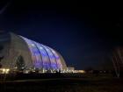 An exterior shot of a former blimp shed, which has been transformed into a massive indoor waterpark