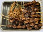 Skewered chicken heads and intestines - yum!