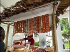 A food vendor at a cultural fiesta, set up in the style of local "sari-sari" stores