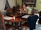 My host mother lit candles and helped me dry my wet laundry during a "brown out," or power outage