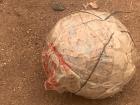 Makeshift football (soccer ball) made with string, plastic, and other misc. items