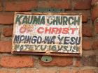 Closeup of the sign for the church: notice the name is both in english and chichewa