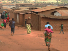 People walking through a central road at Dzaleka Refugee Camp