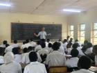 Notice how when they fill the class, some students don't have a desk, only a chair
