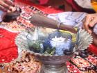 A bowl filled with symbolic items for the tepung tawar ceremony