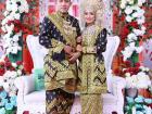 The bride and groom changed into stunning blue songket attire