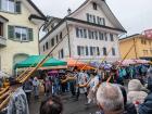 People playing alphorns are also part of the procession.