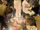 Families lighting candles at the townsquare in Villa de Leyva