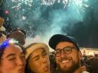 Watching the fireworks with friends in the town square