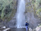 Standing beneath the Salto de Apoquindo waterfall