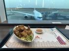 Sitting in front of a window eating Taiwanese fried chicken