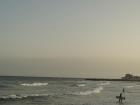 Sitges, Spain, where surfers are heading home for the day