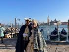 These are people in festive costumes to celebrate Carnevale.