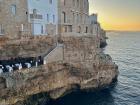 This is a fancy restaurant in a cave on a cliff in Polignano a Mare.
