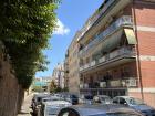 This is an average street in Rome. Most apartments and houses have small terraces and balconies