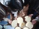 A Korean-style group photo holding our 뻥튀기 (ppong-twi-gi)