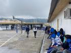The students crowded around the sides of the field to watch the games