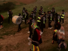 the musicians playing the Auquish music while heading down the hill