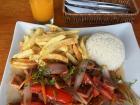Lomo saltado is a stir fry that falls under the category of chifa, or a fusion of Chinese and Peruvian food.