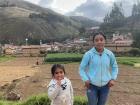 We discuss school as two farmers tend to their field in the background
