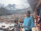 A snapshot from our video interview with the town in the background