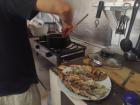 A local helps us make our fish dinner 
