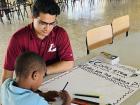 Another Peace Corps Volunteer in a tutor session with a student